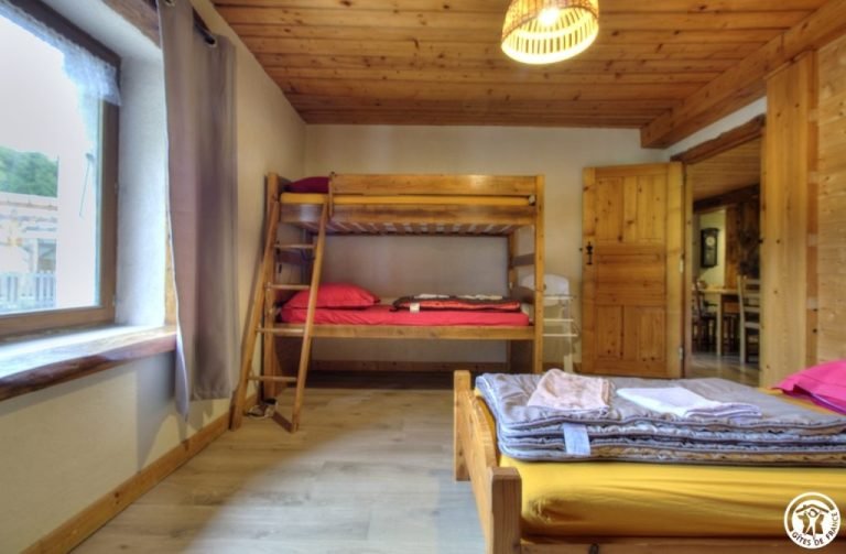 Bedroom with bunk beds and a double bed