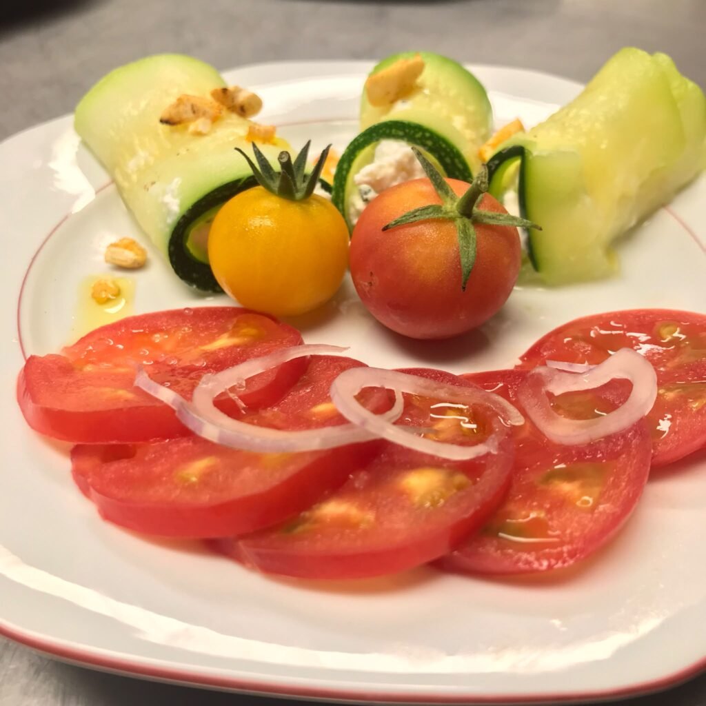 Plate of tomatoes, onion and courgette, a seasonal starter at the inn